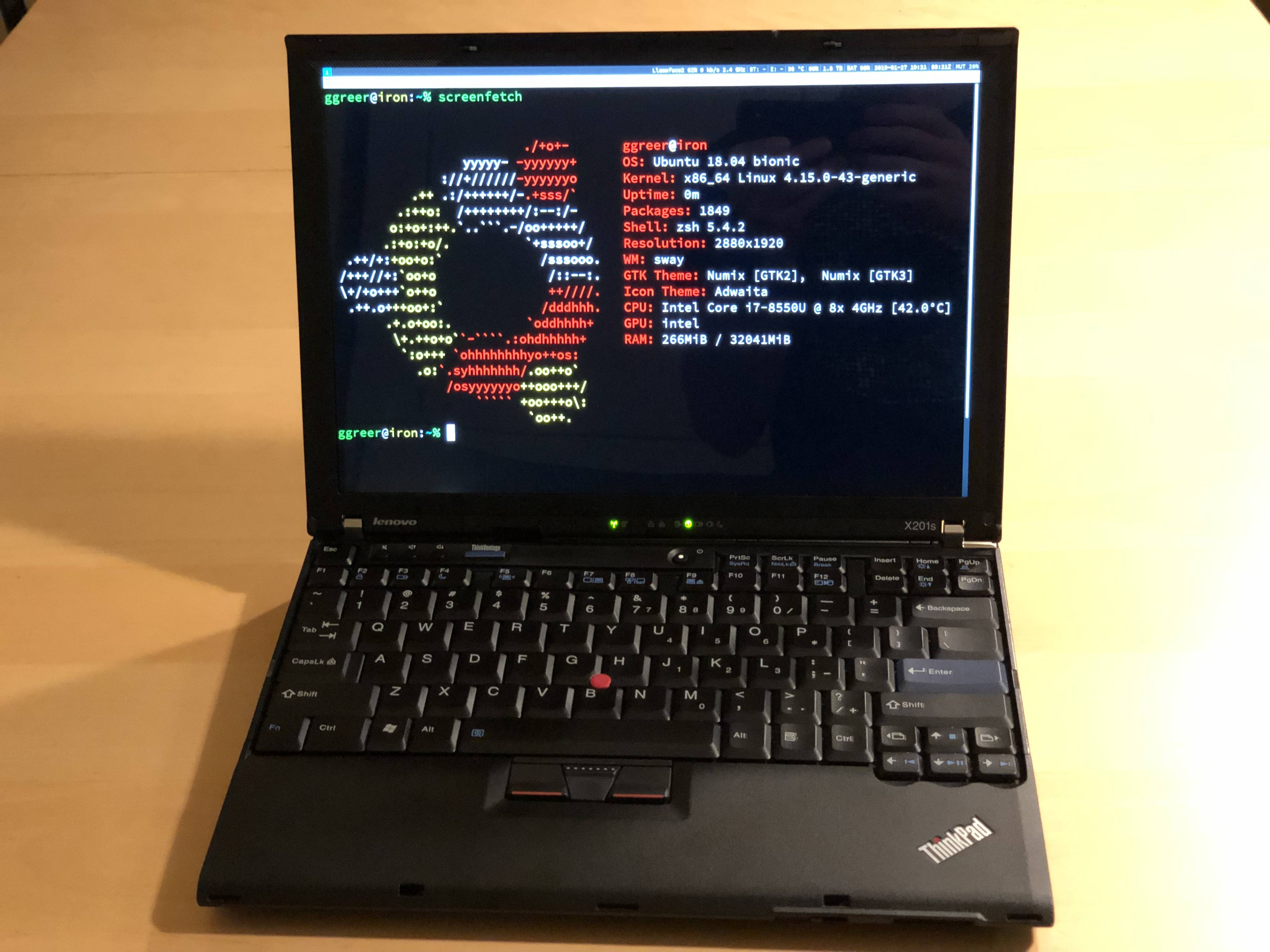 My X210. Fonts are huge so that you can read screenfetch.