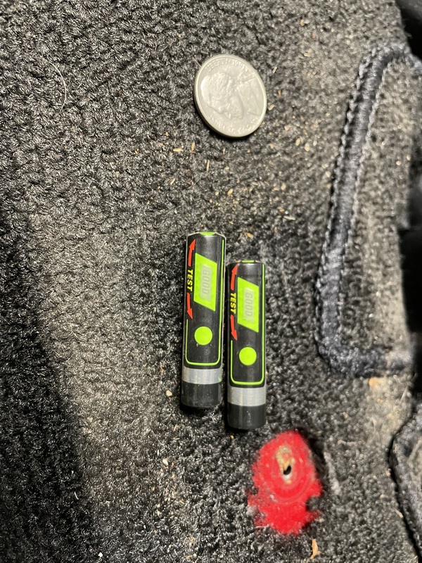 The batteries and change from underneath the console